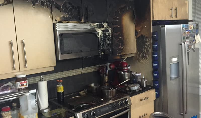Kitchen fire and smoke damage to cabinets and appliances