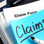 Florida homeowner organizing documents and photos before filing an insurance claim
