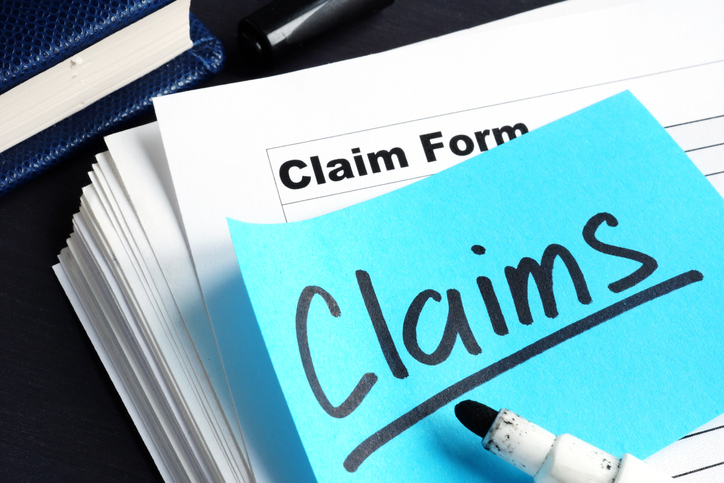Florida homeowner organizing documents and photos before filing an insurance claim