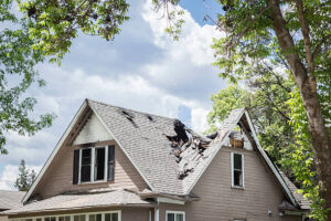 Damaged roof on a Florida home representing a roof damage insurance claim