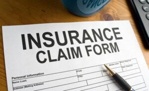 Florida homeowner reviewing insurance claim timeline and paperwork while waiting on claim processing